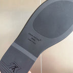 Louis Vuitton slide sandal outsole, gray tread with 'Made in Italy' text