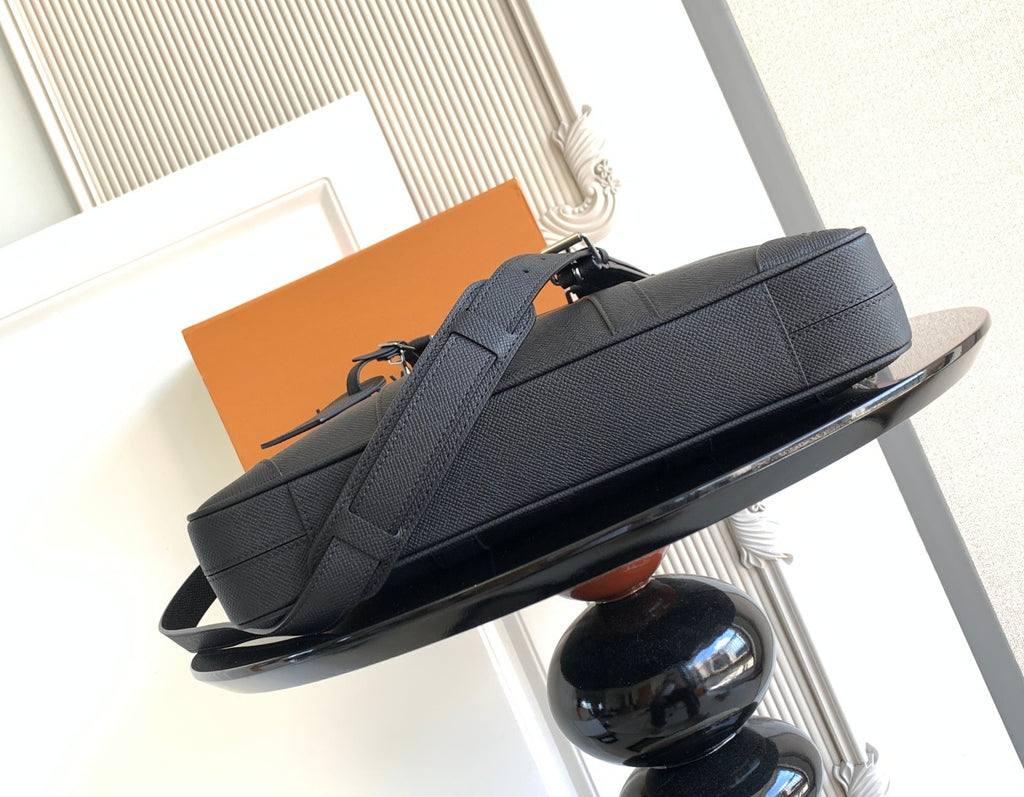 Louis Vuitton bag, dark structured tote with top handle loop and crossbody strap