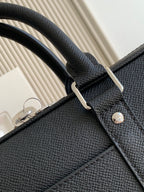 Louis Vuitton bag, dark pebble-grain leather top handle with metal ring attachment