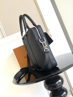 Louis Vuitton bag, dark zip-top tote with adjustable shoulder strap and metal hardware
