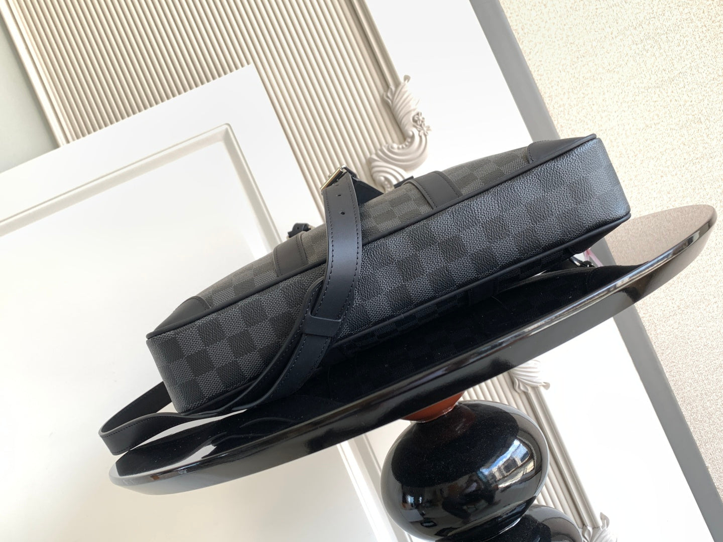 Louis Vuitton checkered duffel bag with long strap and top zipper, dark gray