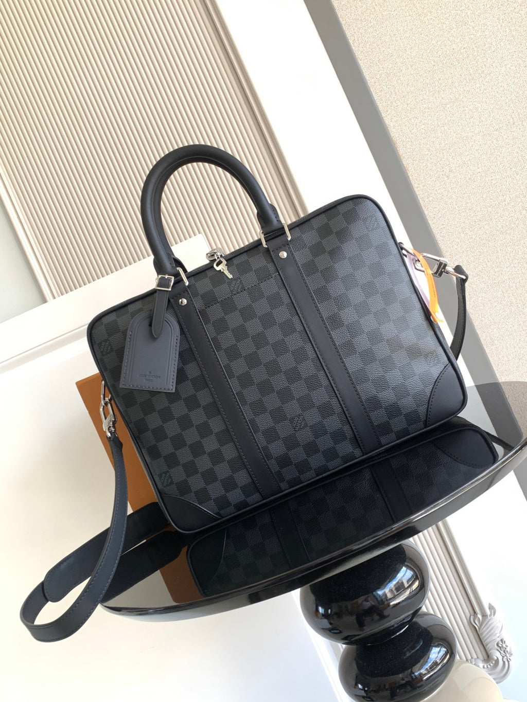 Louis Vuitton checkered tote bag with top handles and front zipper pocket, dark gray