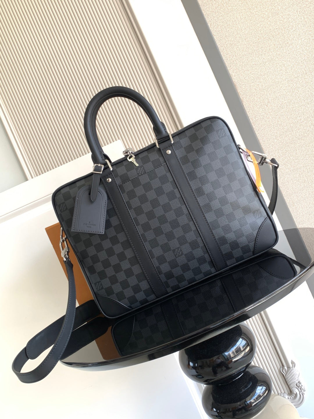 Louis Vuitton checkered tote bag with top handles and front zipper pocket, dark gray