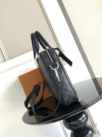 Louis Vuitton checkered bag with shoulder strap and silver buckle hardware, dark gray