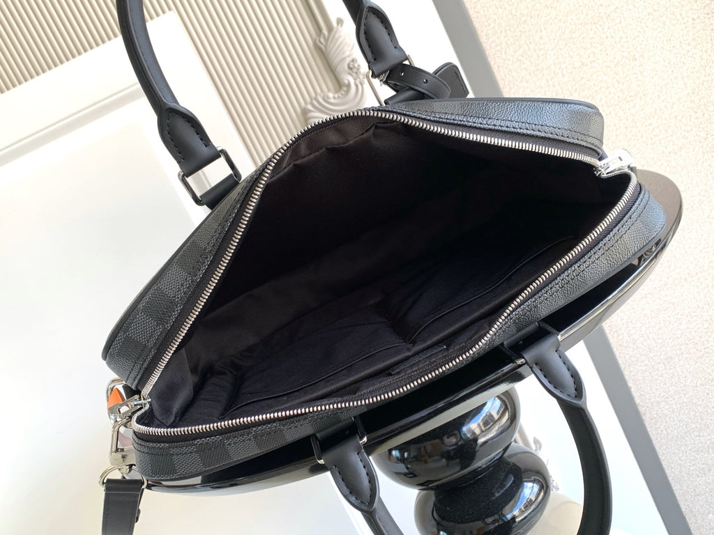 Louis Vuitton checkered bag open top with zipper and dark interior lining, dark gray