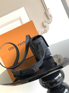 Louis Vuitton monogram crossbody bag in dark gray with side view and strap