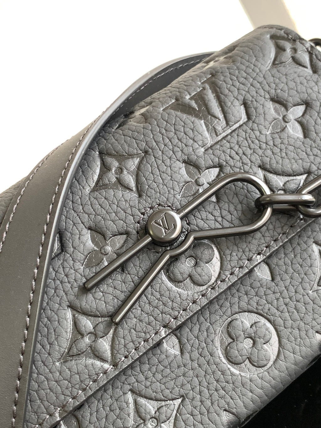 Louis Vuitton monogram satchel in gray textured material with metal clasp