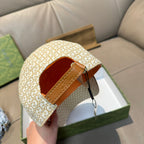 Gucci cap with beige GG monogram outer and tan adjustable strap with buckle