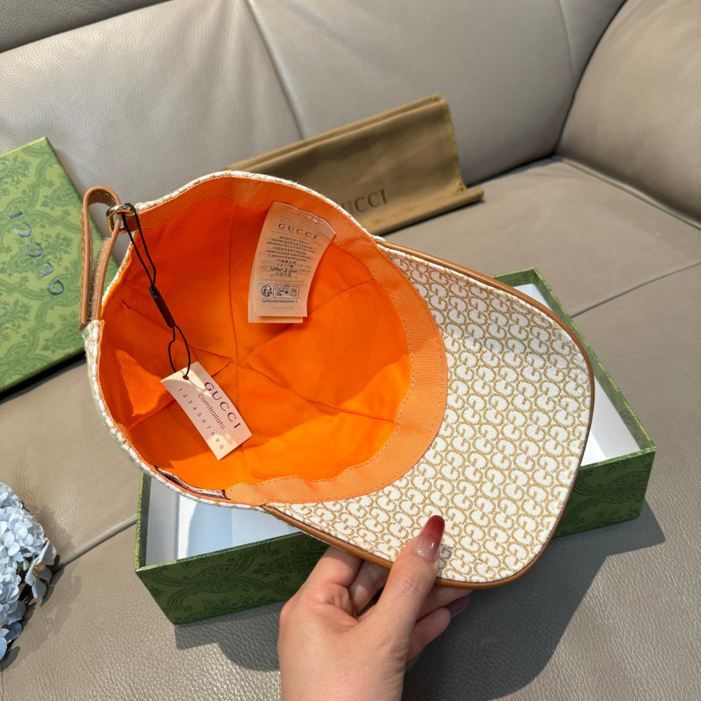 Gucci cap interior with orange lining and beige GG monogram outer