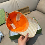 Gucci cap interior with orange lining and beige GG monogram outer