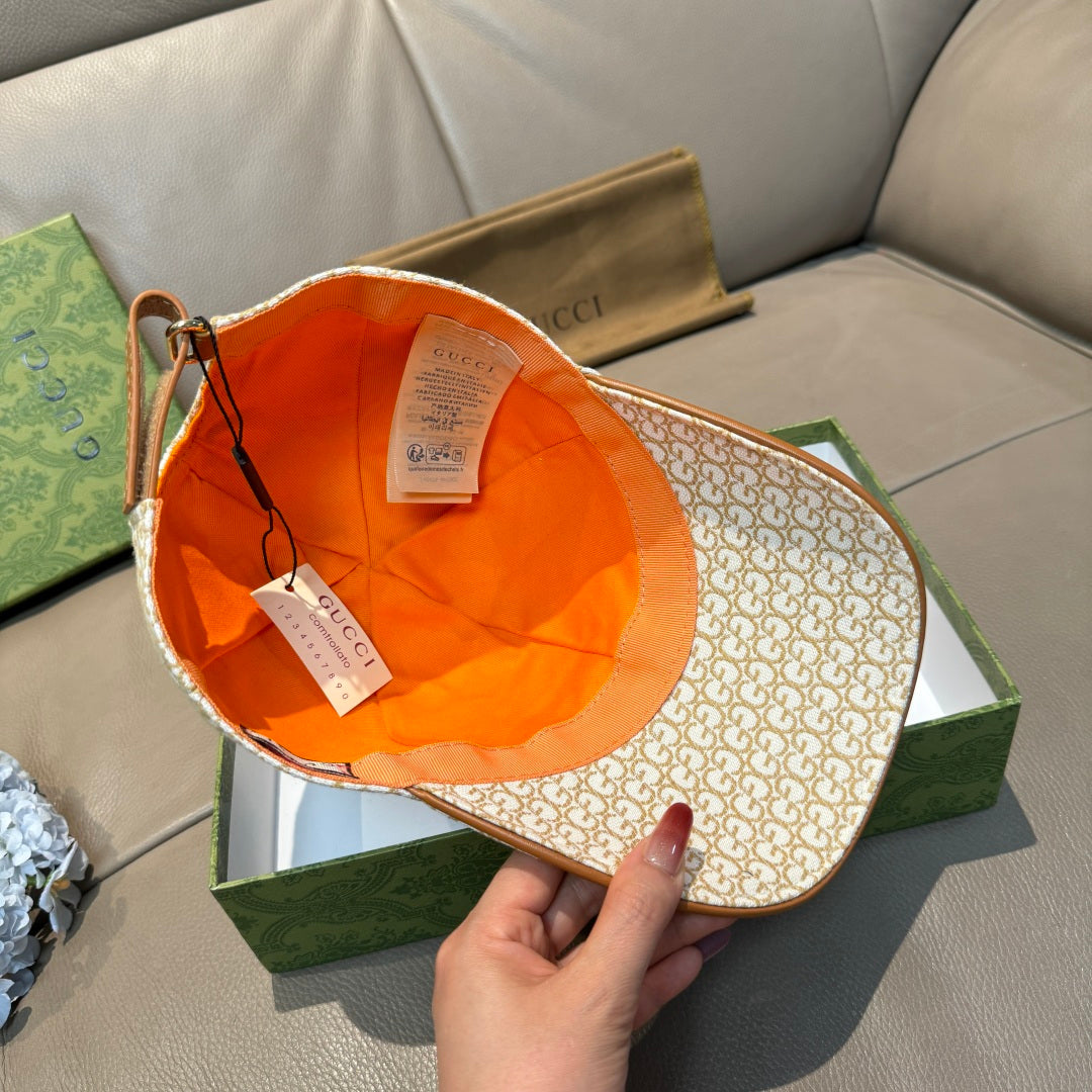Gucci cap interior with orange lining and beige GG monogram outer