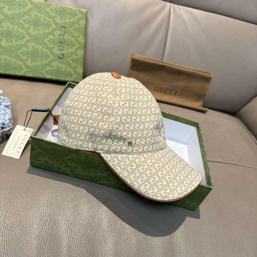 Gucci cap, beige GG monogram print, brown brim trim, and tan top button