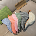 Assorted Gucci caps with GG print in blue, pink, orange, green, and white