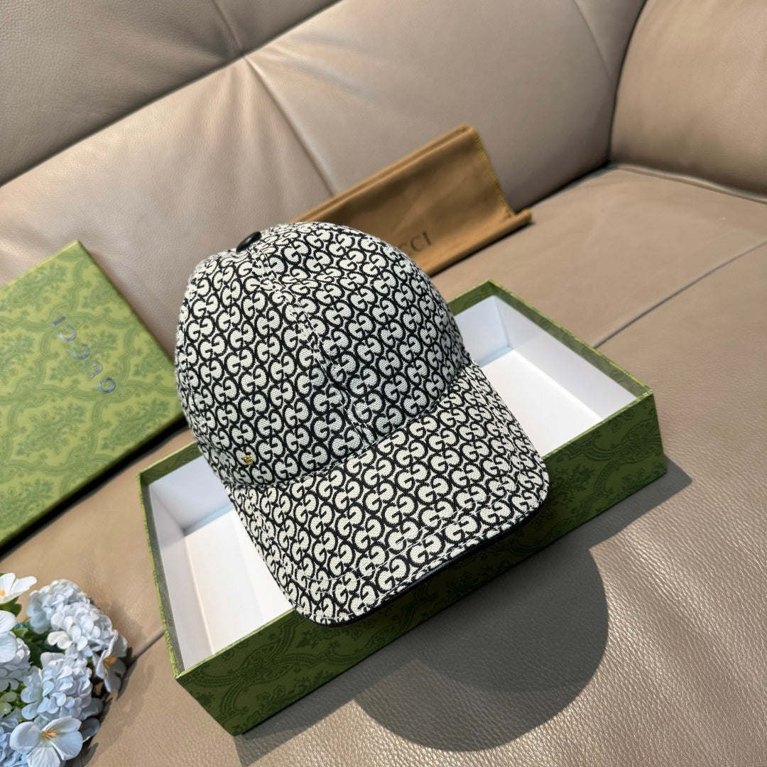 Gucci cap with black-and-white GG monogram allover pattern, curved brim.