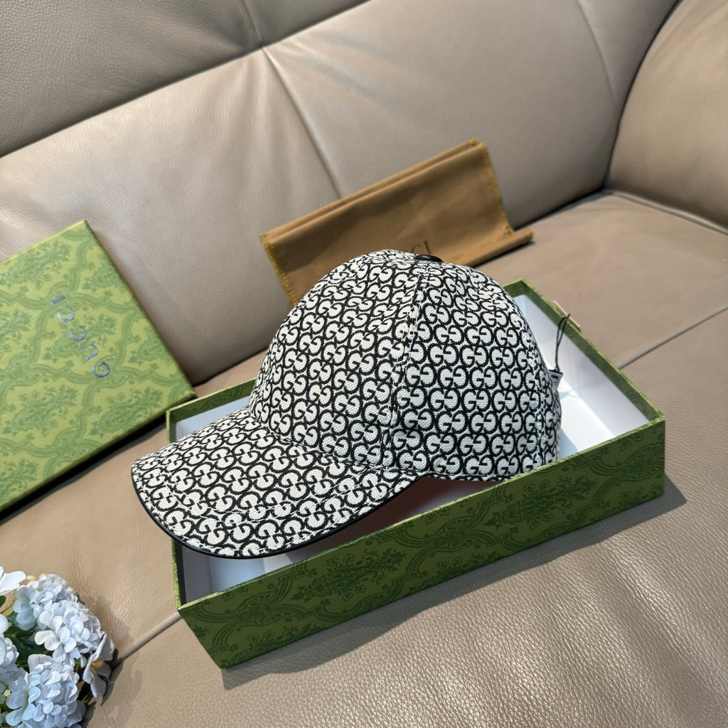 Gucci cap with GG monogram allover pattern, side profile and curved brim visible.