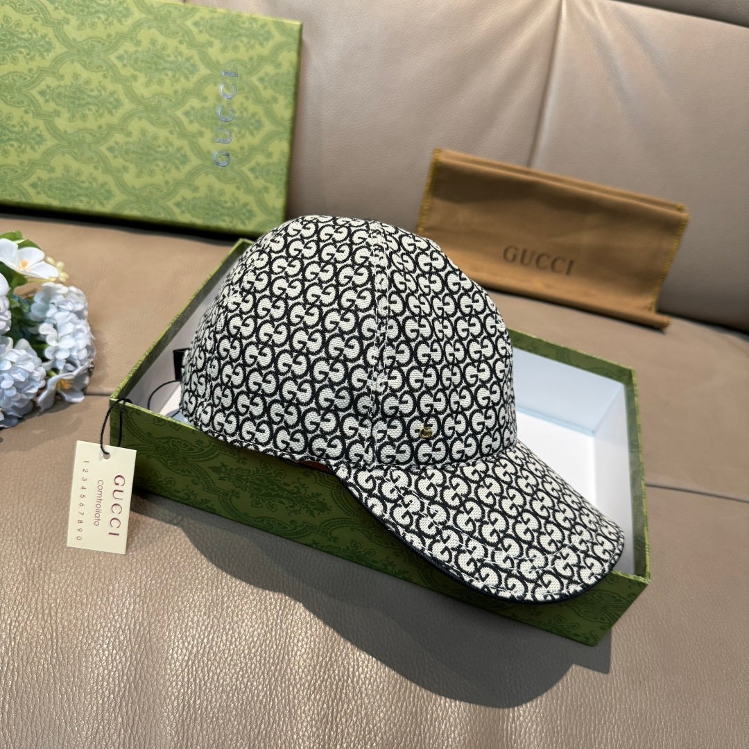 Gucci cap with black-and-white GG monogram allover pattern, top and side view.