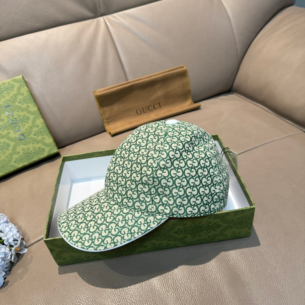 Gucci GG monogram baseball cap in green, angled view with curved brim