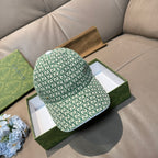 Gucci baseball cap in green with GG monogram pattern and curved brim