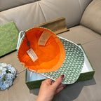 Gucci green GG monogram cap open view with orange interior lining