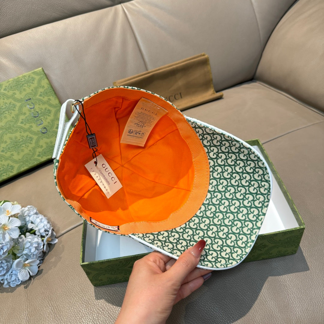 Gucci green GG monogram cap open view with orange interior lining