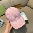 Gucci cap in pink GG monogram print, side view with curved brim