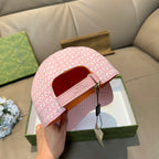 Gucci cap in pink GG monogram print with pink strap and side opening view