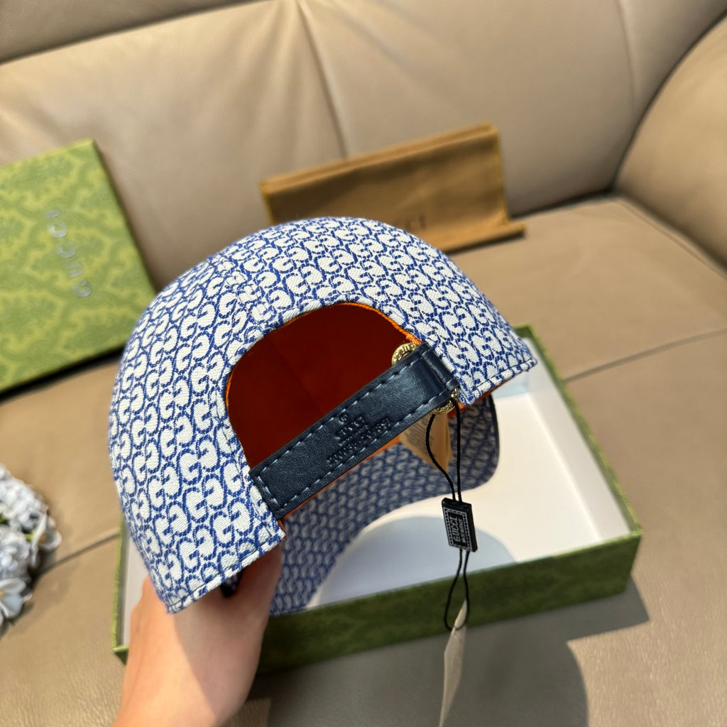 Gucci blue GG-pattern cap interior with dark under-strap and orange lining.