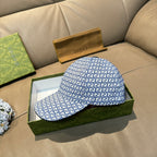 Gucci blue GG-pattern baseball cap, front view with curved brim.