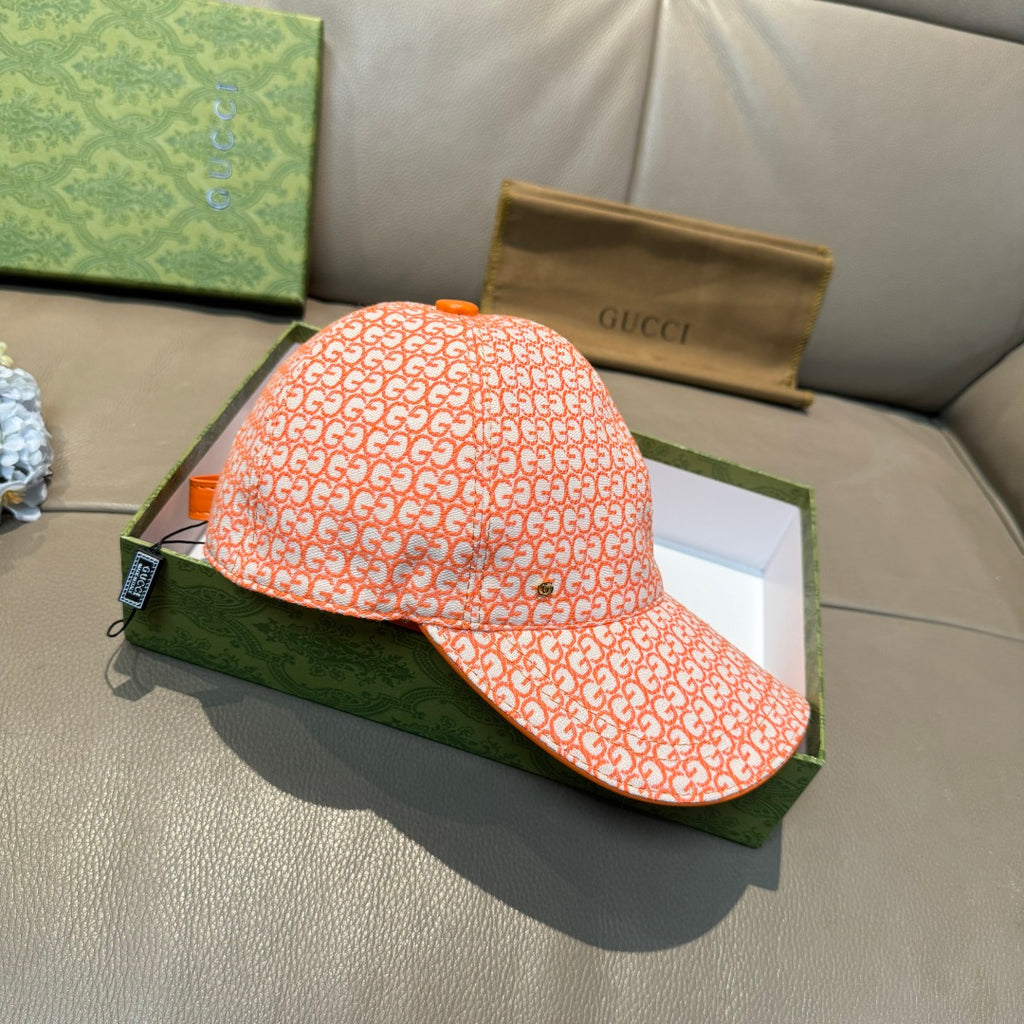 Orange GG-pattern baseball cap, angled side view with curved brim