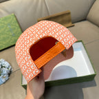 Orange GG-pattern baseball cap with orange adjustable back strap