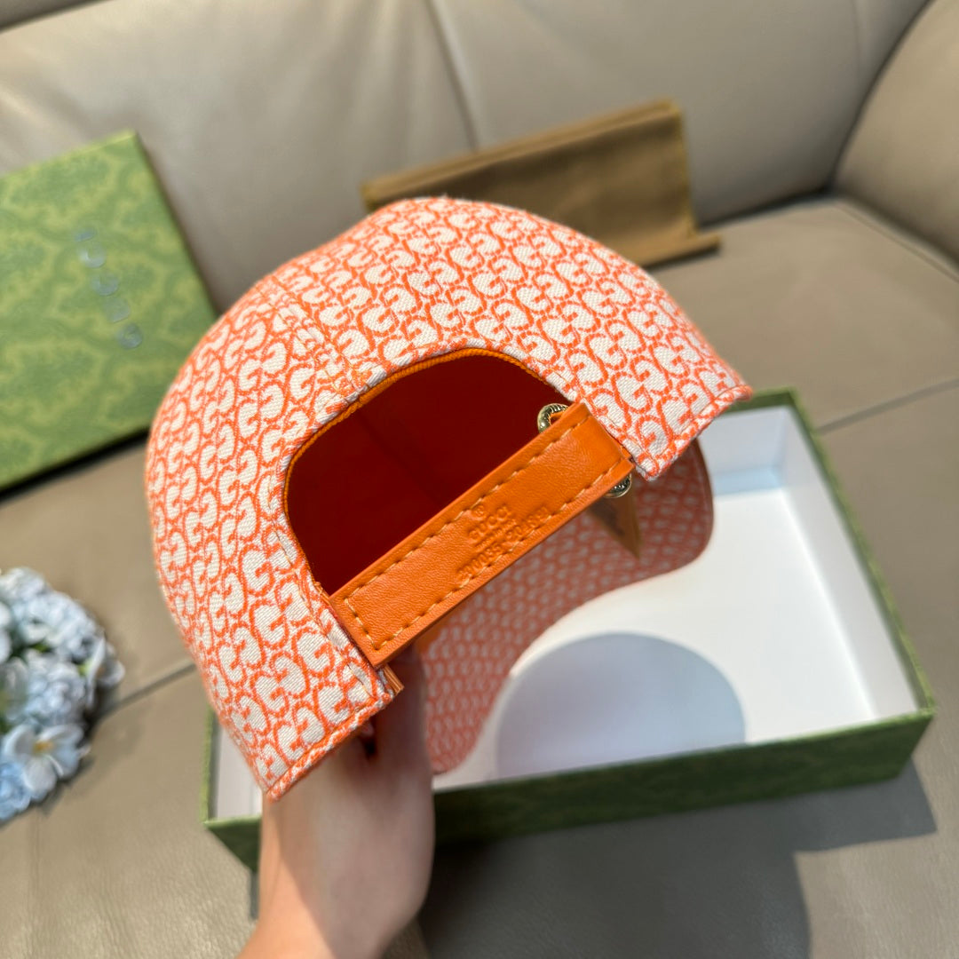 Orange GG-pattern baseball cap with orange adjustable back strap