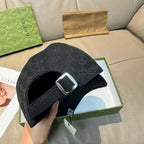 Black Gucci cap with GG pattern and adjustable strap with metal buckle, front opening