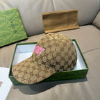 Gucci GG monogram baseball cap with pink logo, tan fabric side view