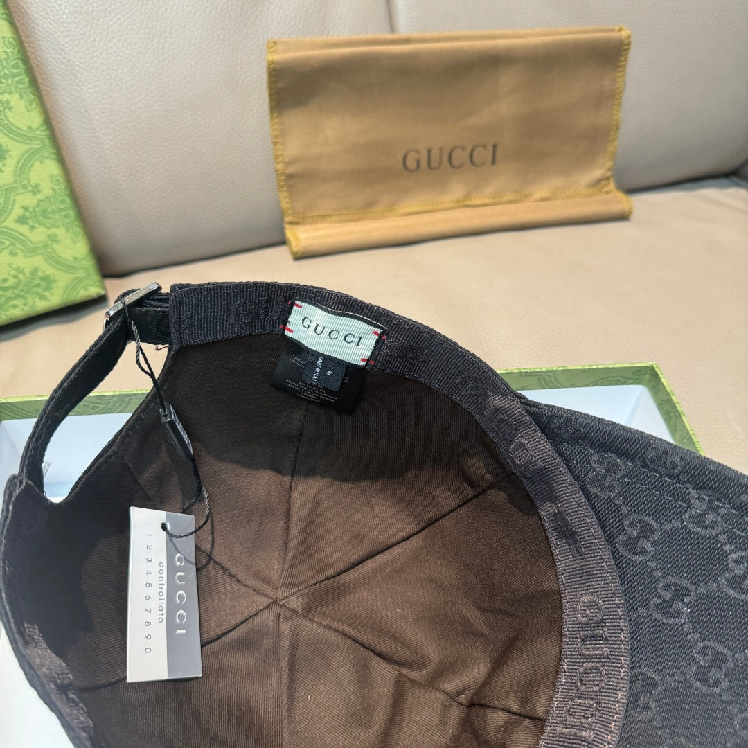 Black Gucci cap interior view with adjustable strap and GG canvas lining.