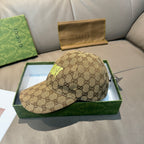Gucci cap in tan GG monogram canvas with neon green side logo and curved brim