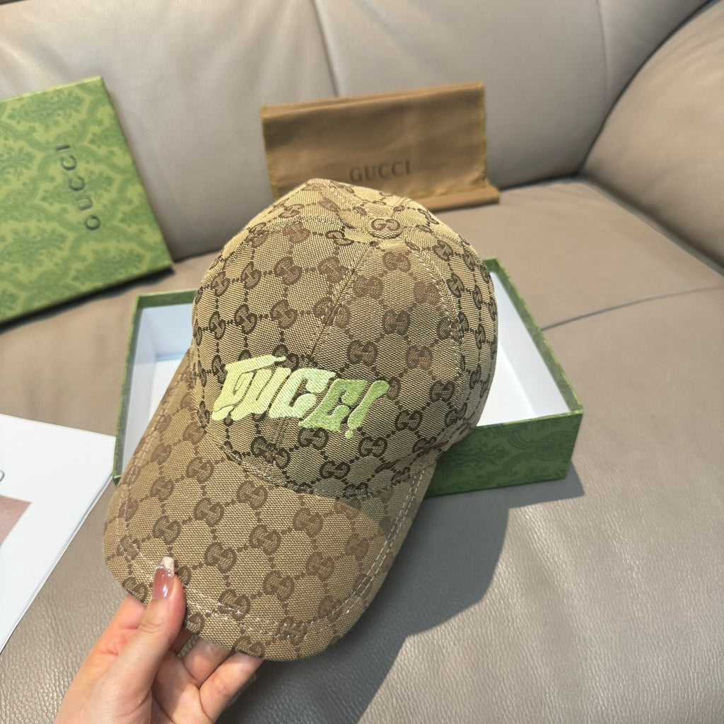 Gucci cap in tan GG monogram canvas with neon green front logo, angled view