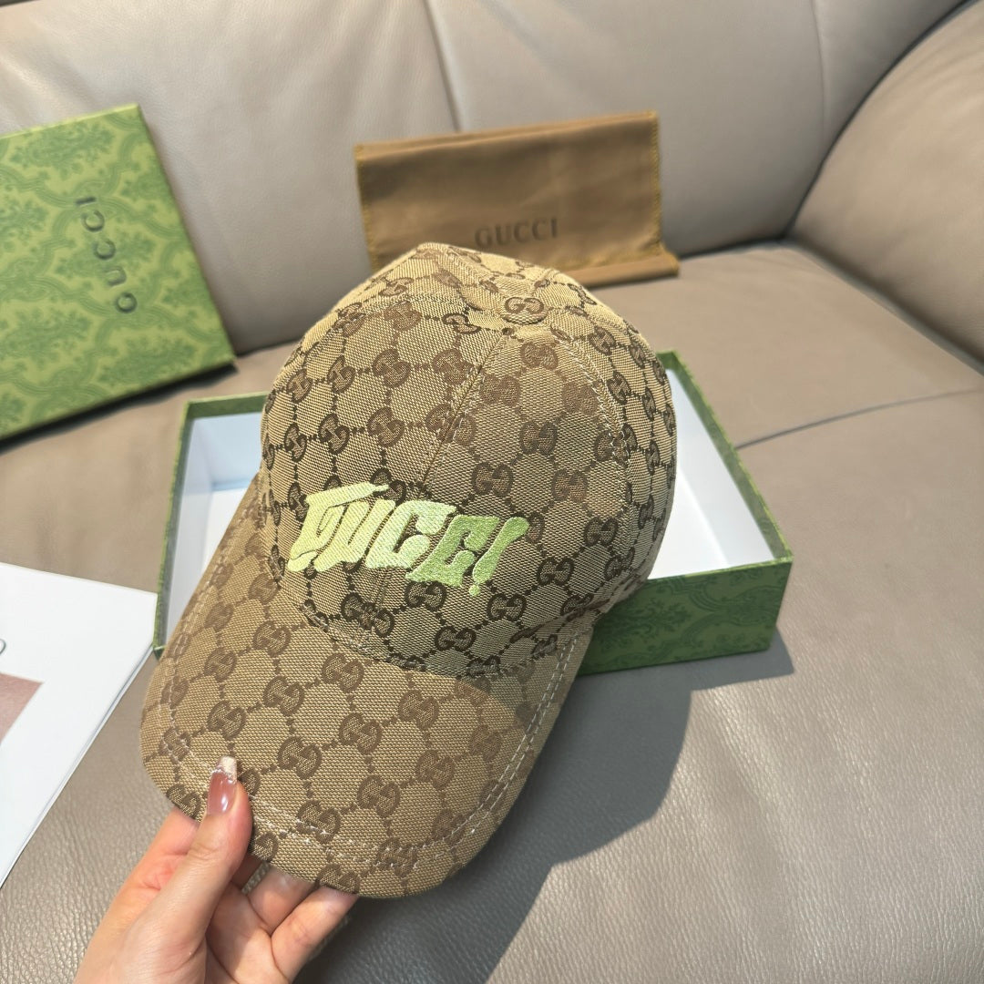 Gucci cap in tan GG monogram canvas with neon green front logo, angled view