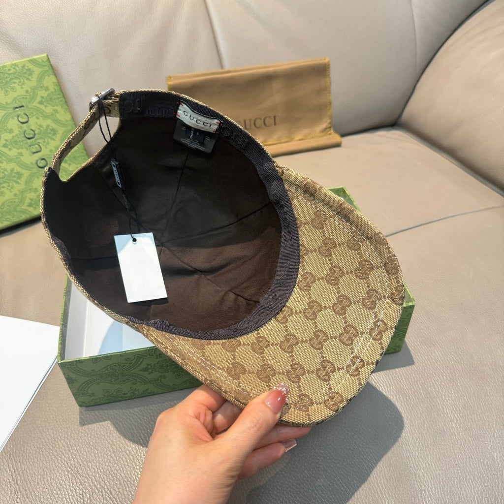 Gucci cap interior view with black lining and tan GG exterior
