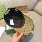 Gucci cap interior view with black lining and tan GG exterior