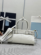 White Prada handbag with arched top handle, front flap, and shoulder strap.
