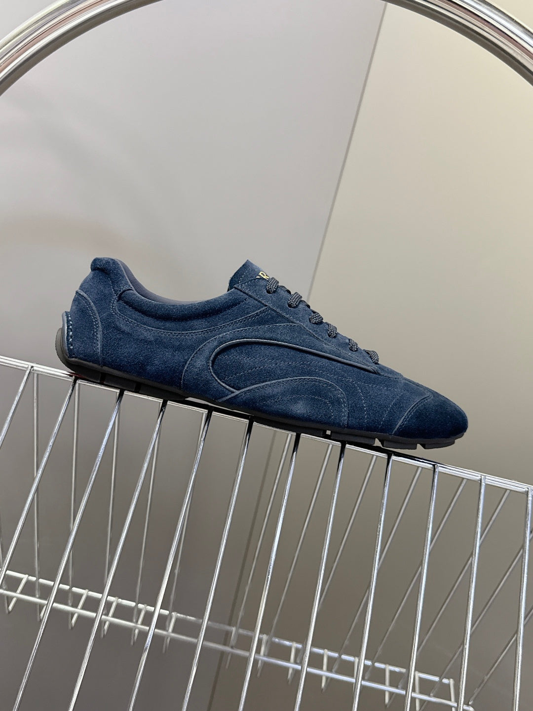 Blue suede low-top sneakers, textured side panel and lace-up front.