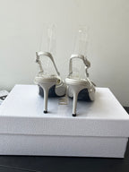 Cream leather women’s slingback heels with stiletto heel and ankle strap
