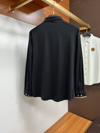Dark navy button-up shirt with spread collar and gold button cuffs detail