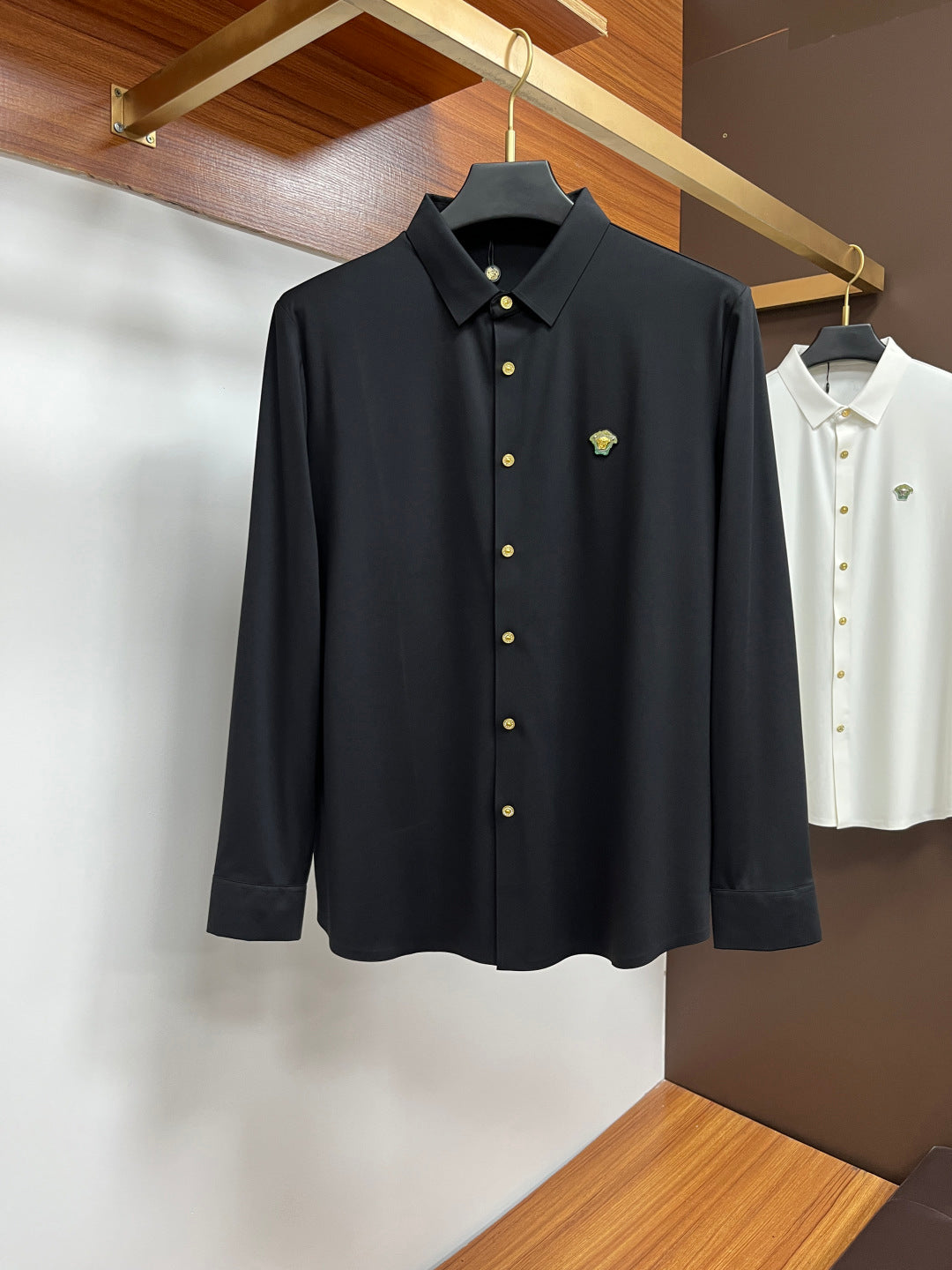 Versace dark button-up dress shirt with gold buttons and small chest logo