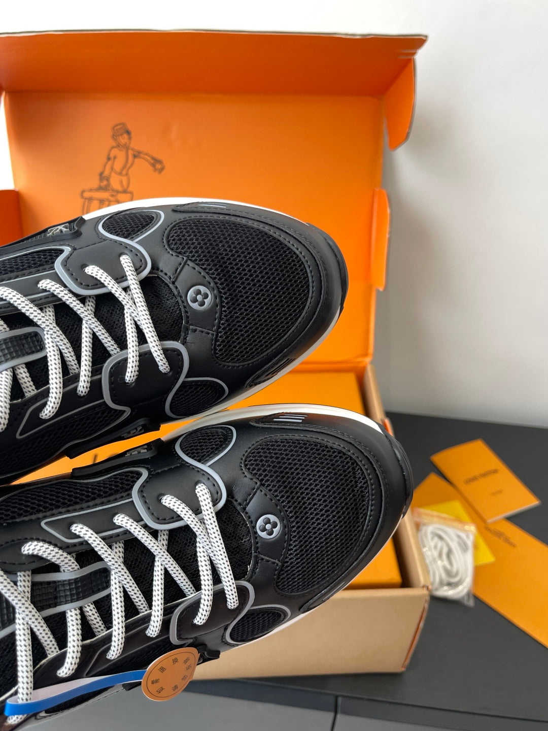 Louis Vuitton ladies sneakers toe-and-outsole close-up, black mesh and lace trim