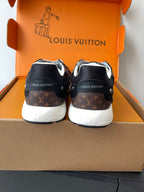 Louis Vuitton ladies sneaker back view, black with brown monogram heel panel