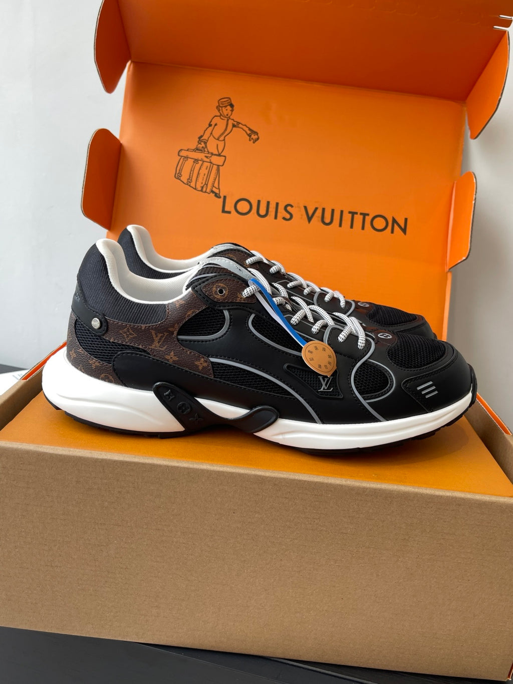Louis Vuitton ladies side-view sneakers, black with white outsole and patterned details