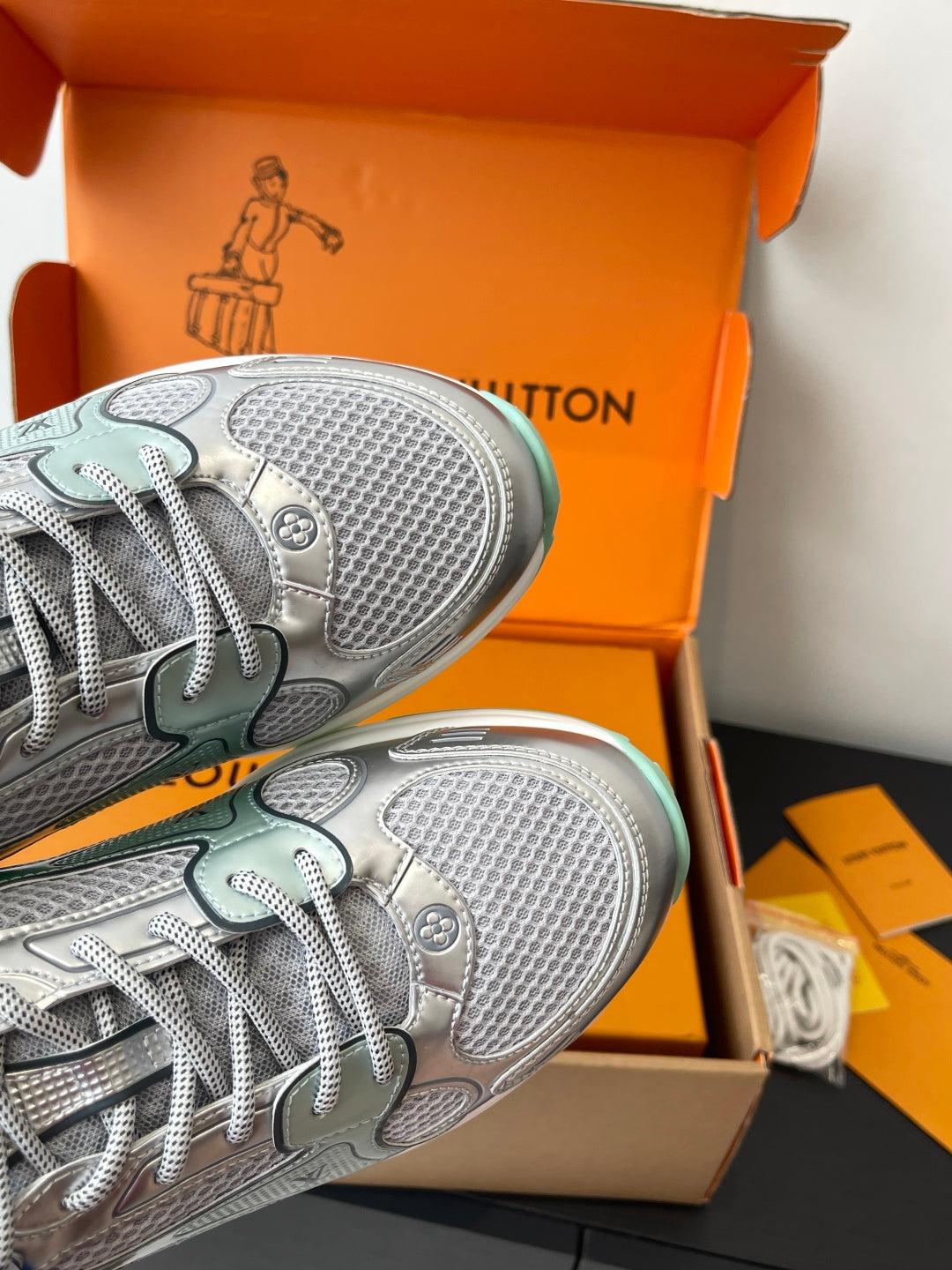 Silver mesh sneaker toe and outsole, mint trim along edge