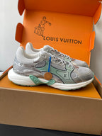 Side view of silver mesh ladies sneakers with mint panels and lace-up closure