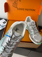 Silver mesh ladies sneaker with lace-up front, mint sole edge and brand on heel